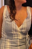 I love this jumpsuit! The quality of the fabric and feel of it are perfect. The only thing is that the top part wraps, but was wayy too loose and no matter how much I tightened it, my bra was always showing. I couldn't go with an xs because the jumpsuit fit perfect on my thighs and hips so I'm still just going to have to wear it with fashion tape. (Apologies I don't have any pics of me standing but the gaping on the straps is visible) - Tiffany P.