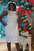 I wore this dress for my bridal shower (luau theme), it went perfectly! I received tons of compliments! The dress is great thick quality material. I ordered a size small, my normal size. However, I have wider hips and thicker thighs so the shirt fit a little tight and the lining would rise up. However, I still love it and highly recommend for any formal occasion. The nelly shows just a tad. You can easily pull skirt up. I had to pull it up higher to be able to zip it well. So I didn't get as much belly action as I would've liked but still satisfied with this two piece set! - Tia G.