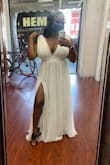 I bought this dress for a beach engagement shoot. I wear a 38 DDD and I'm a size XL or 12/14. I took this to the cleaners and had them make the slit higher and had them sew up the sides of the dress near the boobs for more support! - Ashley L.