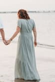 I bought this for a beach engagement photos shoot. I'm not a dress person, and not a 100% confident with my body since some weight gain, but this dress made me feel great. The material was great! Shipped and arrived quickly! - Kristen B.