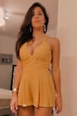It fits perfectly fine. I have a long torso and might look too short for someone like me but it looks beautiful. It is very distinctive. You can wear it to go clubbing or a nice restaurant @ the beach. You can dress up with wedges or flat sandals. - Milena U.