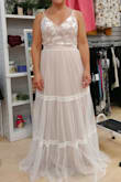 This dress fit fairly well and was pretty. However the under color but the under color is blush and it has a distinctly country look, so it was on the casual side and not quite what I was looking for for. And almost looked more like a prom dress than a wedding dress. That said, I thought it was really pretty it just wasn't very slimming on my frame. I decided to go with something else - Katie S.