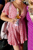 Loved this romper! The fabric is a little drapey on the bottom so it looks more like a mini dress. I just wore a strapless bra that is nude colored and you could see it a little through the keyhole but I wasn't worried about it. I do recommend wearing full coverage underwear because the "shorts" opening is pretty generous and then you don't have much coverage when you sit down if you don't have more than a thong. - Haley O.