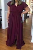 This dress looks beautiful on and is perfectly appropriate for my 13 year old daughter who is one of my bridesmaids. She tried on the XL and it fit but dipped down too far in the front for our tastes. The 1X fit her perfectly up top and covered her up. The waistband is stretchy. She is 5'4 and will need to get it hemmed. But otherwise it is a great fit and a beautiful color! - Karen H.