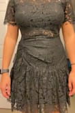 It's not a terrible quality but it's not as dark as the photo and the detail is much more obvious. The lace doesn't look great in person. It's flattering from the front but very unflattering from the side. I purchased to wear to a wedding but I'm returning. It does fit as expected. - Alyssa K.