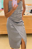 This dress is a beautiful color and material. However, I didn't like the way it fell on my abdomen. I thought it would conceal my stomach, but it had the opposite effect. - Nicole C.