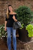 This shirt is classic. Off the shoulder gives it an added layer of sexy while also being subdued. It's totally fitted and shows every curve so be warned. If you tuck it in, it has the body suit feel. I wore it with flare jeans and platforms. - Ashley B.