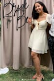 This dress was so adorable and perfect for my bridal shower! I received so many compliments. The tie front is so cute and the material/length is perfect (like a cocktail dress) for a hot day. The bust would probably be small for someone with a larger chest but I am a 32B so the small worked fine for me (5"5', 150lbs, smaller waist, broader hips). Love and would definitely recommend! - Nichole H.