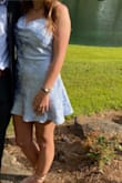 Dress was super comfortable and flattering for a summer wedding. It was right around the bust, but in a good way. Unique style, would wear again! - Madison J.