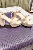These shoes fit true to size. I have wide feet and they are comfortable for me. My only small complaint is they are much lighter in color than expected, almost a cream color instead of the tan I was expecting. Otherwise love them. - Karrie H.