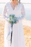 This dress was perfect for my Covid 2020 elopement November wedding. We had a small ceremony in Texas at a rock cliff lake and the details in the dress stood out perfectly. The details on the sleeve and the back of the dress were to die for. I loved how stunning the lace was and it was exactly what I was wanting. I am a little small chested and so getting a size large, made the top a bit too large, but I had double-sided body tape to stick it down so my boobs would not peep due to the wind. It worked perfectly fine! I highly recommend this dress for anyone who is having a small ceremony or one by the waterfront in the winter! - Kimberlyn B.