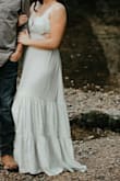 This was my first ever lulus purchase, I bought this dress for my engagement photos. The dress is soft, light and flowy. I did have to steam dry the dress to get out the wrinkles from being packaged. My only complaint is that I wish this dress had built in padding for the bra because of the way it is shaped, but I ended up finding a strapless bra that fit the shape. Love how my photos turned out from this dress :) - Mikayla F.