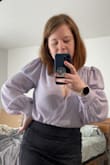 This is an amazing top. Perfect for pairing with a skirt. Runs true to size. May need a tiny piece of tape or a stitch as front kind of pops open. - Jennifer L.