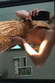 This dress is beautiful and fun! I am usually a small or a medium in dresses and I sized down in this dress due to the flowy nature of it. The top is a little loose on me (see picture) and gaps out on the armpit side. That is why I'm rating it 4 stars instead of 5. I am a B/C so I'm not sure what it would look like on someone smaller chested than me. The photo would only upload sideways, but the rest of the fit is great! - Christina M.