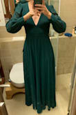 The dress itself is beautiful, perfect to wear for my sister's wedding as maid of honor. I have an athletic build though and while the size is definitely the right one for me, I have a lot of extra room in the belly/hips and would definitely have to get it hemmed if I wasn't wearing 4 inch heels (not too big a deal, makes it extra swishy) but can't really lift my arms over my head because the proportions just weren't made for me. So if I went to a L it would look much too large but if I went to a S I'd probably rip the armpits just reaching forward. It looks good though, and is warm enough to wear outdoors in WA in mid October. All in all I'm happy with it but it would be a little more flattering and comfortable if I'd been able to give my specific measurements.

I do love the back, and the neckline is quite flattering. It would work even if I had much bigger breasts too (oh well, they have tape for that) - Maya C.