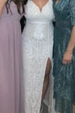 Run, don't walk to go buy this dress!!! It fit me SO well. I changed into this as my reception dress at my wedding and it was so comfortable! The high slit was great for dancing and I got so many compliments. It held my boobs up too, no need for a strapless bra. I was so happy I bought this dress! - Dara H.