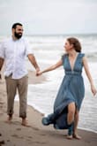I bought a number of dresses to use in my engagement shoot but this was the one! The fit was beautiful and it was nice and flowy! I used some tape to keep the chest down but the bust fit well otherwise. It was a bit long but worked with heels. It was stunning! - Daniela A.