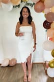 This dress was perfect for my bridal shower!!! I got so many compliments. It fit pretty perfectly, the only loose part was right at the top but it still stayed up. I wear a 6-8 in jeans and 32D bra so I think part of the fit was just due to my smaller upper half. Super flattering! - Mackenzie M.