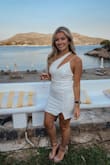 I wore this dress to a white party in Greece and got so many compliments on it! It was very flattering, especially considering it's solid white. The material is stretchy but form-fitting, so it was comfortable to dance in all night long. 100% recommend! - Lauren U.