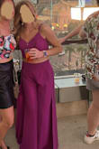 This outfit turned out beautifully. I wore it to an evening out in Las Vegas and received so many compliments. Unfortunately I did have to take it to a tailor. I'm glad I got it tailored because it is a stunning outfit that was perfect for my night out. Multiple people said I looked like a movie star! The waist was slightly too small (I could zip it but it was quite tight) and the length was way too long for my 5'2" height. Thankfully the tailor was able to open up the waist an inch and a half and shorten the hem by about 2 inches. I'm short and carry my weight in my hips, what can I say? Also the pants have a very high slit - it shows a lot of leg when you sit down. I didn't mind, but some might. Also, be careful with the tie back. It became untied during travel and was very difficult to re-assemble, you will need another person to help put the ties back into the loops. Worth it and will wear it again to my next fancy night out! - Cristina B.