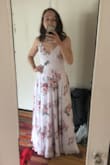 This dress fits wonderfully for me, a woman with a smaller chest/upper body, and larger lower body(butt/legs)! It is flattering and comfortable. I am generally between a small and med for dresses depending on if it is tight on the top or bottom and the small fit perfectly. Like other reviews say, it is kind of long, but I think will be okay with 2-3inch heels. Can't wait to wear it to a wedding this month. - Sara N.