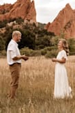 This was absolutely perfect for our wedding! I did get it hemmed about 1/2 an inch? I wore a wedge shoe with a thick heel! - Lacey T.