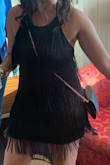 Wore it out to party in Old Las Vegas. Was funny because several of the "dancing girls" at casinos wore similar style outfits (fringe!) The dress is a little tight in hip area but a size up would have been too big up top. Material is nice, held together great, hand washed and laid flat to dry, looks brand new still after all that - Allison P.