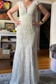 This dress is truly beautiful, the fabric is of great quality and drapes beautifully. Love the train! It runs pretty long, and I'm fairly tall, wearing 2 1/2 inch heels in the photo. I ultimately decided to go with a different dress, because I didn't want to have to have it altered. - Debbie S.
