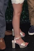 This shoe runs large. I am normally a true 6 but with these my foot slides all the way to the front because the front straps are looser on me, causing the back of the shoe to have a large gap.

Other than that the shoe is very comfy and the satin is a nice quality for the price. I would just size down one full size. - Nicole B.