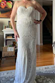 This dress is absolutely gorgeous, but it runs very small in the bust. I had to order up two sizes to even get it zipped up all the way! It looks great on, very flattering, and is very long, so would definitely need hemming. I'm fairly tall, and wearing 2 1/2 in heels in the photo, and it is still puddling on the floor. The sequins scratched me up pretty badly just while trying it on, so I don't think I could survive wearing this dress all day. I ultimately chose a different Lulus dress, that is almost identical, but without the sequins. - Debbie S.