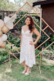 I wore this dress for my bridal shower and it couldn't have been more perfect. I got a large, which was a tad bit big on me, but still looked great and I wasn't stressed about it being tight around my stomach and could have fun! Loved it! - Felicia L.