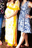I wore this to my baby shower and received SO many compliments! I'm 34 weeks, 5'6" and 170 lbs. The size medium fit like a glove. Felt like a mama goddess the whole day. - Melissa C.