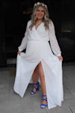 I got married in this dress at 19 weeks pregnant and it was a dream. I felt like a goddess in this dress. I ordered my pre-pregnancy size and it fit perfectly but if I was not  pregnant it would have been too big so I would definitely size down. I'm short so the length needed to be hemmed but the sleeves were also a bit long so we hemmed them as well. It comes a bit wrinkled because of the material but nothing a home steamer couldn't fix. 1000% recommend! - Amanda L.