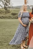 I am currently 8 months pregnant and this dress was perfect for an outdoor wedding! It's so comfy and stretchy and absolutely gorgeous. I got many compliments on it. I ordered my usual size and it fits great. Would highly recommend it! - Kate L.