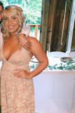 It fit absolutely perfect and was so comfortable. Has a decent amount of cleavage but the back is adjustable so you can make sure the front is held taught enough to hold your boobs in. Seriously such a great dress for a wedding and looked great in photos. 10/10! - Leanne N.