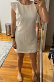 Love the design of this dress. I like that it's form-fitting but not skin-tight. The sizing was good for me, I'm usually a 4-6 on top and a 6-8 on bottom. There is somewhat of a mismatch, in that the design is a little fancy, but the material is not. Also, as others have mentioned, the hem at the bottom is a hot mess. It's super sloppy, but can't be ironed, so I'll have to take it to a seamstress if I want to look polished. I steamed it before taking the attached pic but you can see there's still a ways to go. - Christine G.