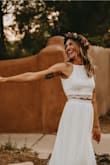 This dress was perfect for our front yard wedding in Santa Fe, NM. I felt like a boho goddess. The fit was very flattering, and I was comfortable all night long. The dress photographed wonderfully, and the slit gave it effortless, beautiful movement. I had a couple alterations made - had it hemmed, had the adjustable straps swapped for straps that fit me perfectly, and had the back opened up just a little bit more. I looked at so many dresses, and I would pick this one over and over again. I said that this one runs a little large because according to the size chart, the XXS size should have been a little bit too small for me, but it fit perfectly! - Laura H.