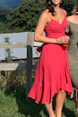 This dress is everything! True wrap dress with adjustable straps, so customizable to your liking. The color is so pretty in person and the material feels expensive. If you're small chested, may want some fashion tape or a safety pin if you're not trying to show the girls. I'm 34C and was surprisingly fine without either. Loved that I could wear a strapless bra with it too.  10/10 recommend! - Katie H.