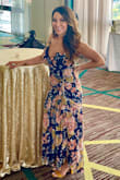 I bought this dress for a wedding and absolutely loved it!  Unlike other reviewers, I felt it ran true to size. The top was supportive enough that I didn't need a bra. The ruching was so flattering and comfortable and the length was perfect for me.  I got a ton of compliments on it as well! - Tia H.