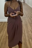 I ordered a bunch of dresses for a wedding and this was my winner!! I felt like a million bucks in it! Such a beautiful color and perfect length! Top part was very tight. I had to go braless but the material is thick enough that it wasn't a problem. If you are bigger than a 34C, SIZE UP. I was at the threshold of a S being just tight enough without being uncomfortable. The material doesn't stretch at all, but straps are adjustable. If you are curvier than me I encourage you to size up! - Bana I.