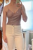 This fit my measurements beautifully! I did have to custom order a bodysuit extender (7") from Etsy, because this bodysuit fit all my proportions except my height. It does pull down to a true high-waist, even on longer torsos. It's really cute in person and the ruching at the side adds some really good depth. - Mary L.