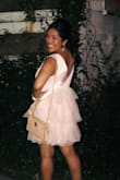 This dress is adorable! It's fun but sexy at the same time. I did wear sticky boobs to hold them in place due to the low cut, but it's what makes the dress sexy. The large fit okay but I do think the medium would have fit better. I got so many compliments :) - Arlyn C.