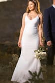 I wore this dress for my elopement ceremony. I'm 5'5 I weighed about 135 lbs I was also 4 months pregnant. The size small fit well and it was not too tight. The fabric is nice, thick, and stretches a bit. The dress was very comfortable over all and the length was perfect with heels. I liked the simplicity and classic style of this dress. Thank you Lulus! - Fabiola G.