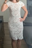 This dress is really pretty! The white part is super soft and the nude underlay is a silkier material. It's form fitting but comfortable. The webbing between the leaves feels delicate, so be careful of handling the dress when you're not wearing it so it doesn't snag on other hangers/clothes. The cut out in the back is really unique and flattering as well! The only part I'm trying to figure out is the seam that runs horizontally under the chest - it makes a visible bump on my dress, but I may just need to adjust the fabric after I put it on. - Mary H.