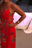It fit perfectly, I wore it to a  summer wedding and it was perfect ! It's super comfortable the skirt is flowy and loose not tight, it stays on as long as you tie it correctly  just as pictured on the model.  The top has adjustable straps i  didn't wear a bra because it would've been to tight with the top so I opted to not wear one and adjusted he straps a bit tighter.

The color is just as the picture and its good material looks expensive :) - Mj C.