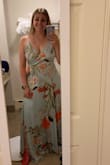 Loved the dress! I had been working on loosing some weight for the wedding so I should have bought a medium but I bought 3 months earlier. Also, should have gotten it altered as it was a tad long on me, even in 4 inch heels. But material was light and breezy, perfect for a hot June wedding. - Kira K.