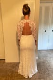 This dress fit true to size and was lovely on. The back detail is everything. The price was so low and so were our expectations for this dress, but we were pleasantly surprised at the nice quality. Delivery arrived within a few days of ordering. Very happy. #LuvLuLus - Tracy S.