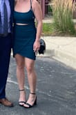 Body con dress with a little flare. Love the cut out detail in the front. The emerald green is the perfect color!!! Definitely a sexy dress. I wore this as a guest at a wedding. - Lauren R.