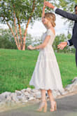 I love this dress, I wore it for our engagement shoot. Runs a little small on top but photographs so well! - Rachel R.