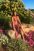 This was a beautiful option, it's light fabric  for a spring/summer wedding. the color is more of a darker pink i would say; I'm 5'2" so it wasn't terribly short on the asymmetrical side! A beautiful option though. I got a lot of compliments over this dress! though it does wrinkle a lot, and the photos show it has a shiny glitter to it- it does not- it's just one color no glitter or texture added. a good buy! Thank you Lulus. - Julie G.